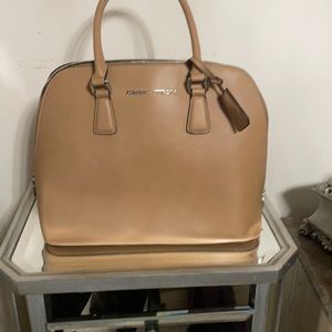 A brown/tan Adrienne Vittadini purse